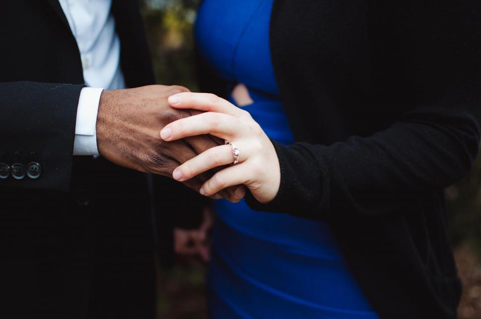 Free Image of Close Up of Two People Holding Hands 