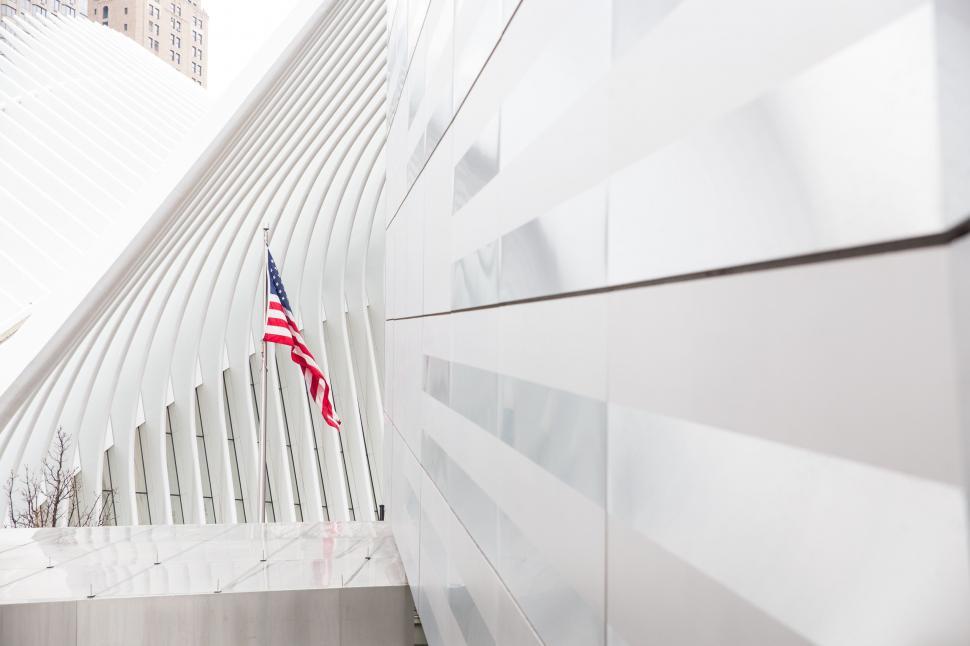 Free Image of American Flag Displayed on Side of Building 