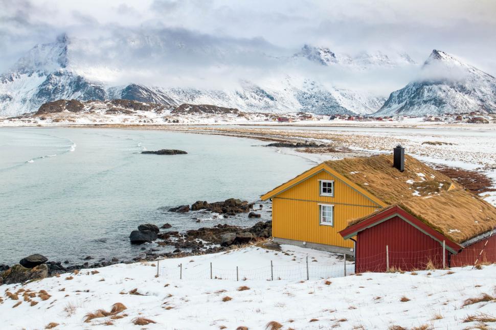 Free Image of Yellow House in Snow Covered Field 
