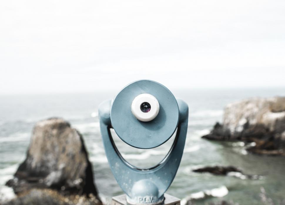 Free Image of Statue of a Face on Top of a Rock by the Ocean 