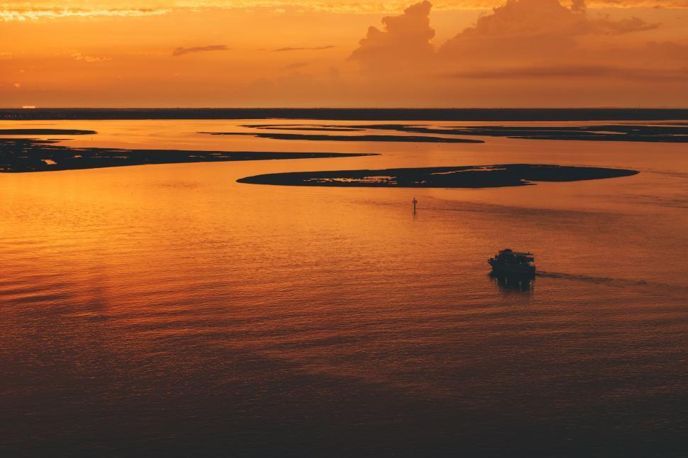Free Image of Boat Floating on Large Body of Water 