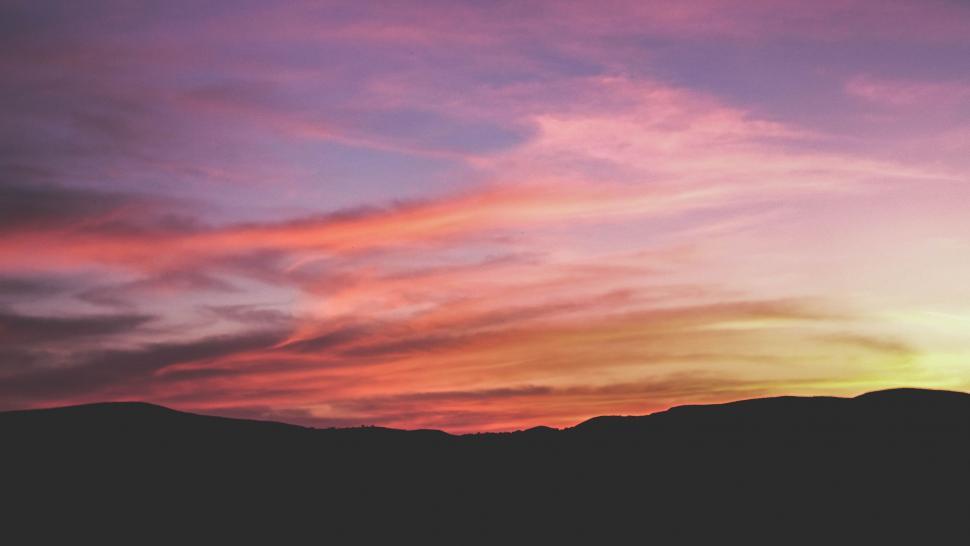 Free Image of Sunset With Plane Flying in the Sky 