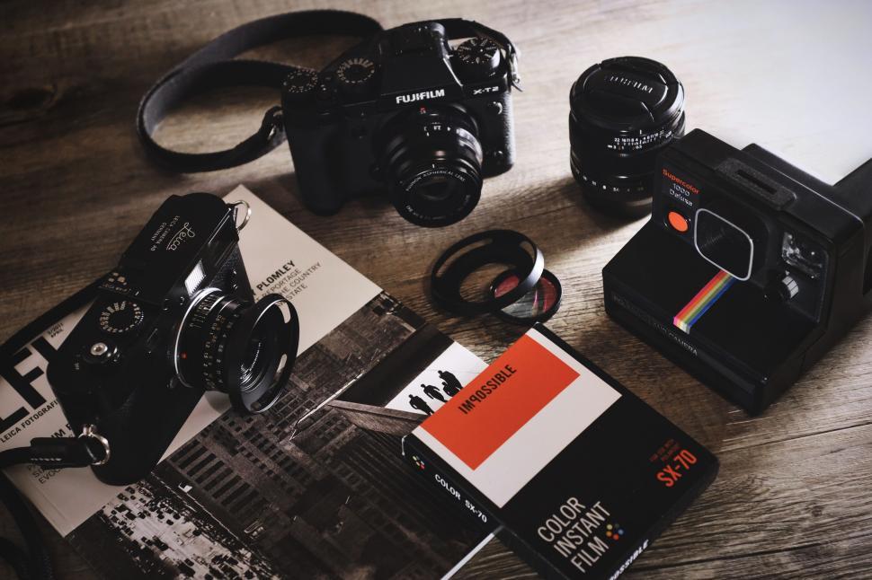 Free Image of Camera and Various Items on Table 