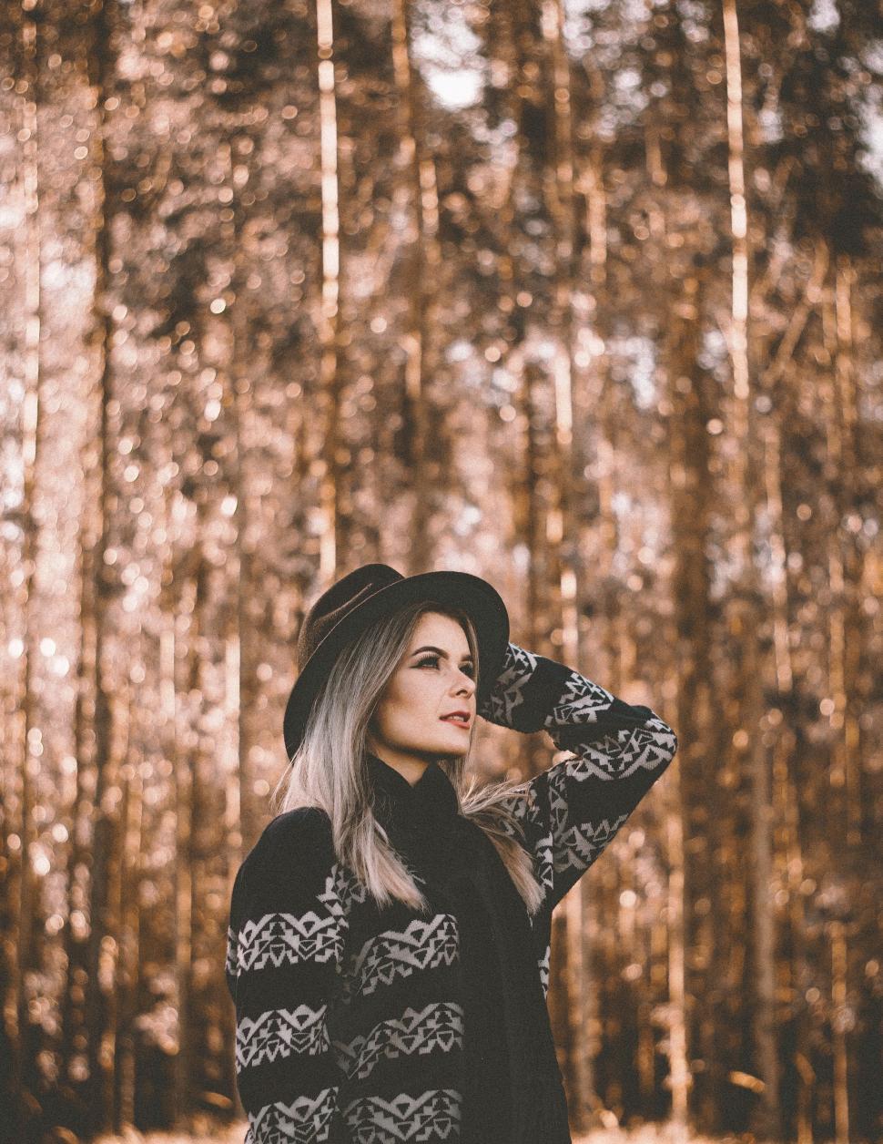 Free Image of Woman Standing in Woods With Hat 