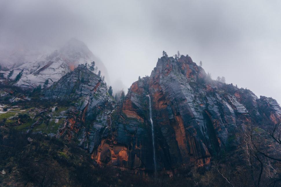 Free Image of Snowy Mountain Enveloped by Clouds 