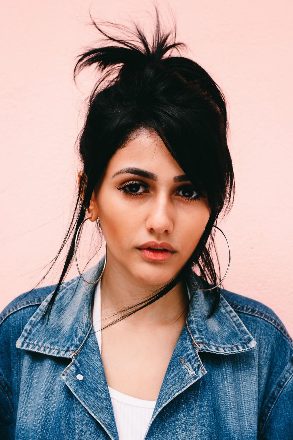 Free Image of Woman With Black Hair Wearing Denim Jacket 