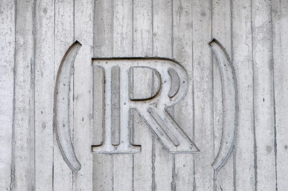 Free Image of Logo Adorning a Brick Wall 