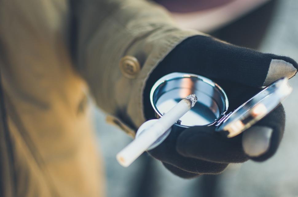 Free Image of Person Holding a Cigarette 
