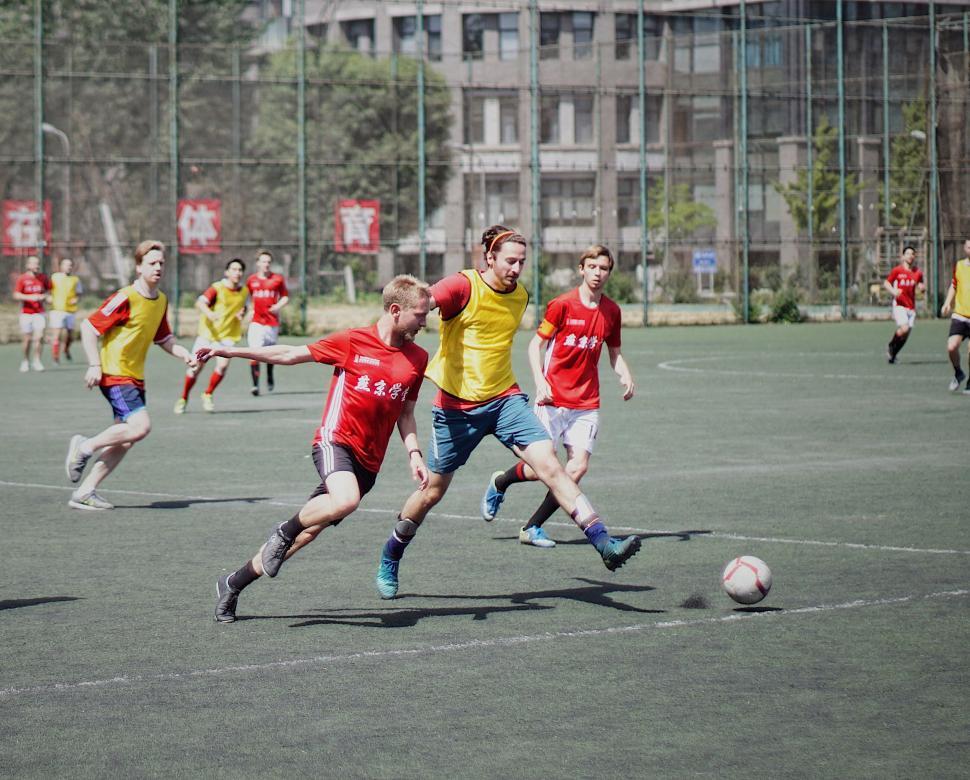 Free Image of Young Men Playing a Game of Soccer 