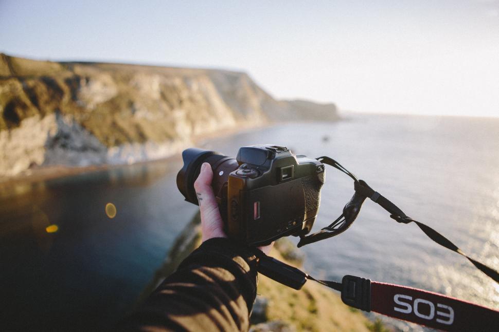 Free Image of Person Capturing Picture of Body of Water 