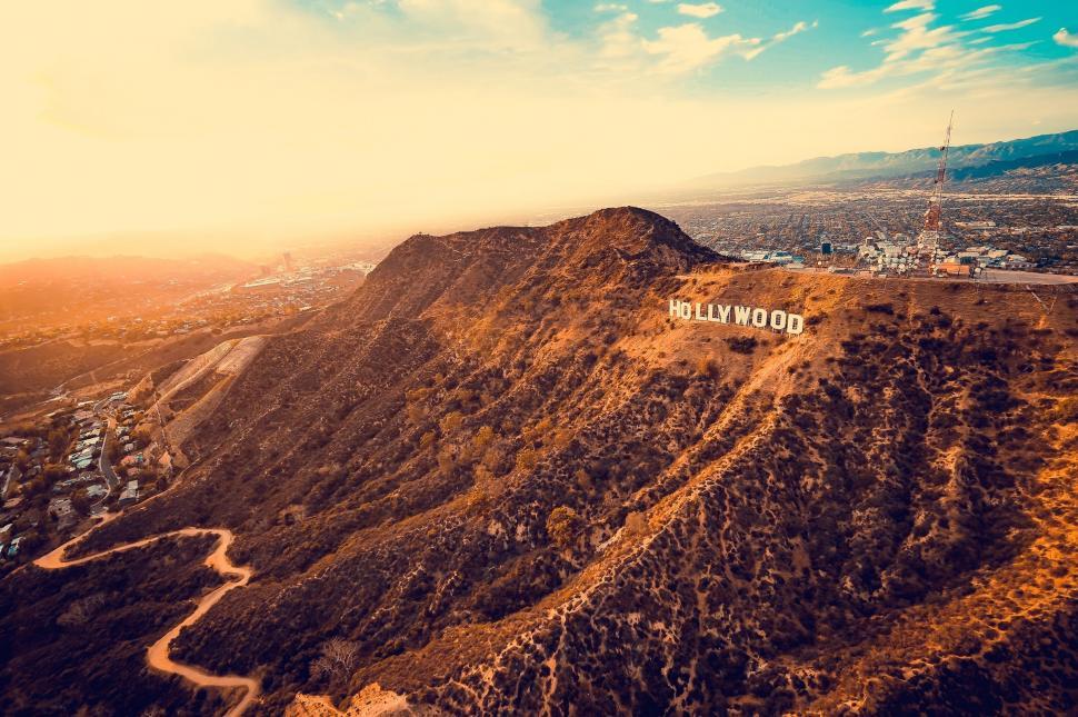 Free Image of Sign Standing Atop Mountain Peak 