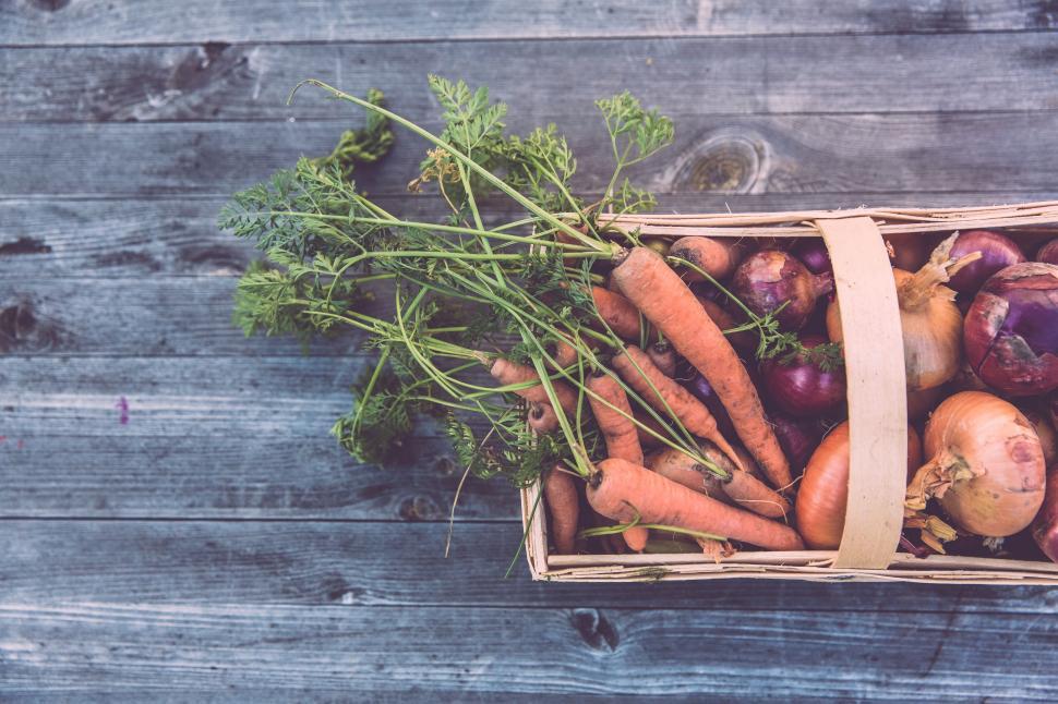 Free Image of Basket of Carrots and Radishes on Wooden Table 