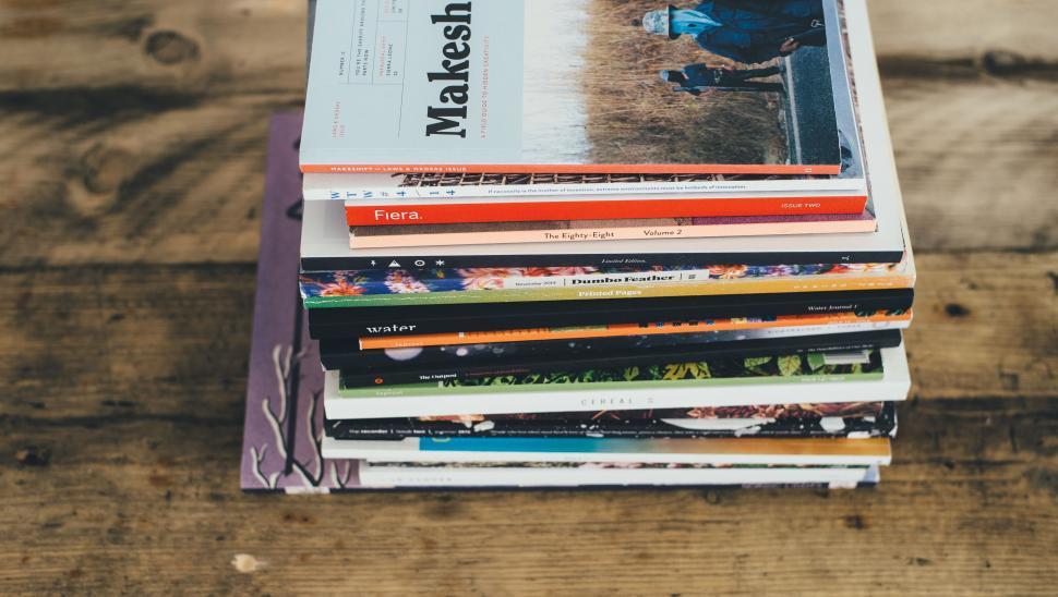 Free Image of Stack of Books on Wooden Table 