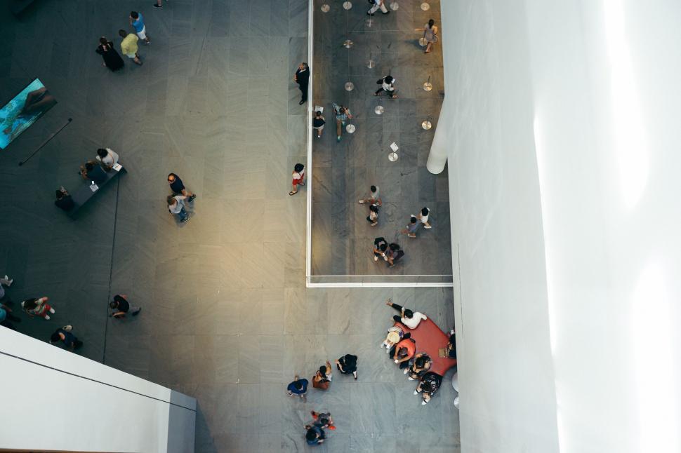 Free Image of Group of People Standing Around a Building 