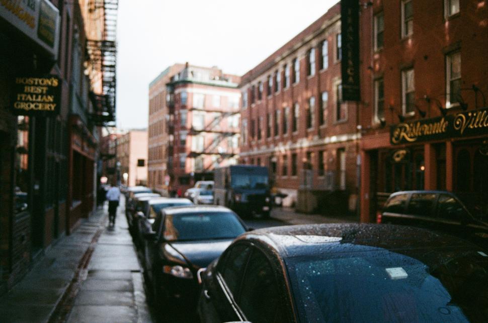 Free Image of A Row of Parked Cars on a City Street 