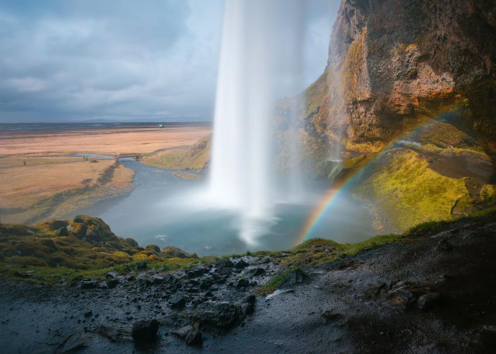 Free Image of Majestic Waterfall With Rainbow 