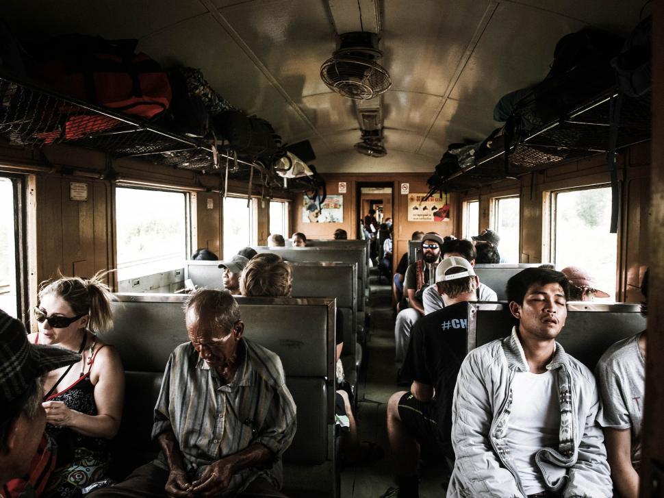 Free Image of Group of People Sitting on Train 