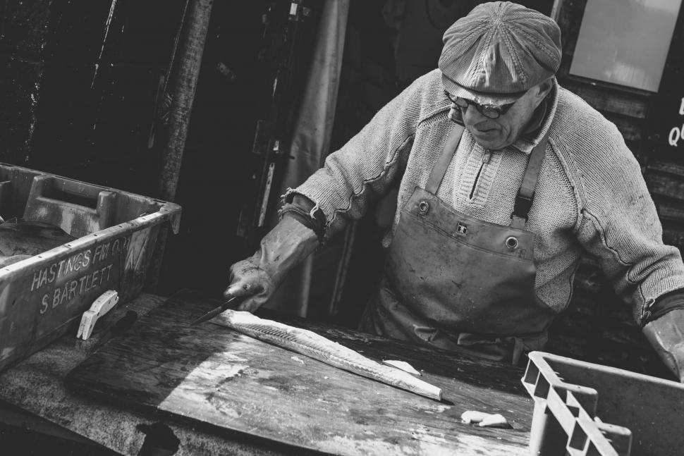 Free Image of Man Working on Piece of Wood 