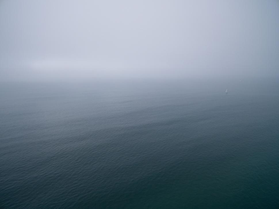 Free Image of Misty Lake Surrounded by Fog 