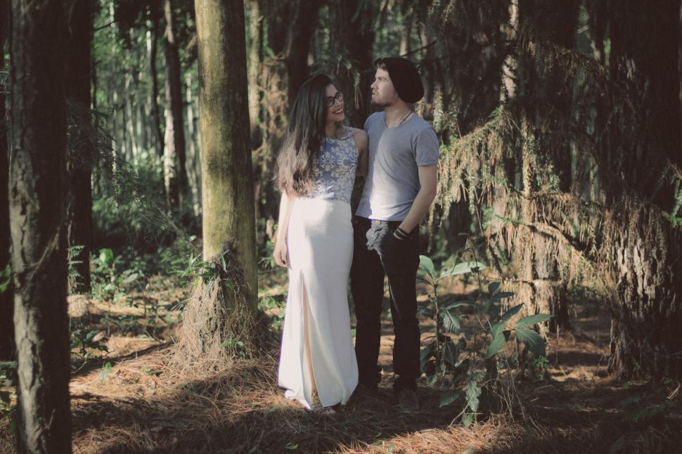 Free Image of Man and Woman Standing in the Woods 