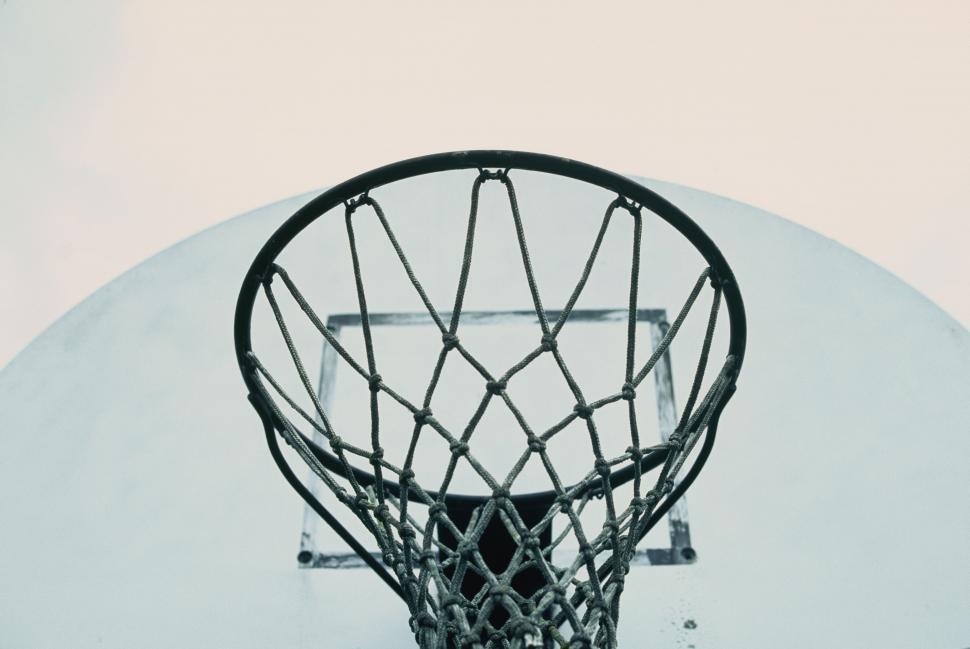 Free Image of Basketball Swishing Through Basketball Hoop 