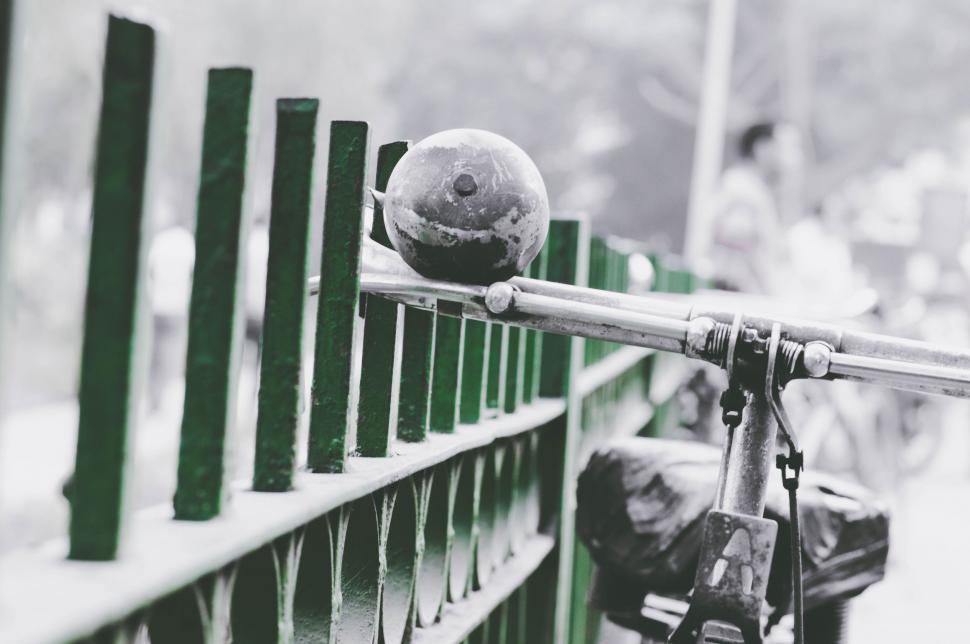 Free Image of Ball Resting on Fence 