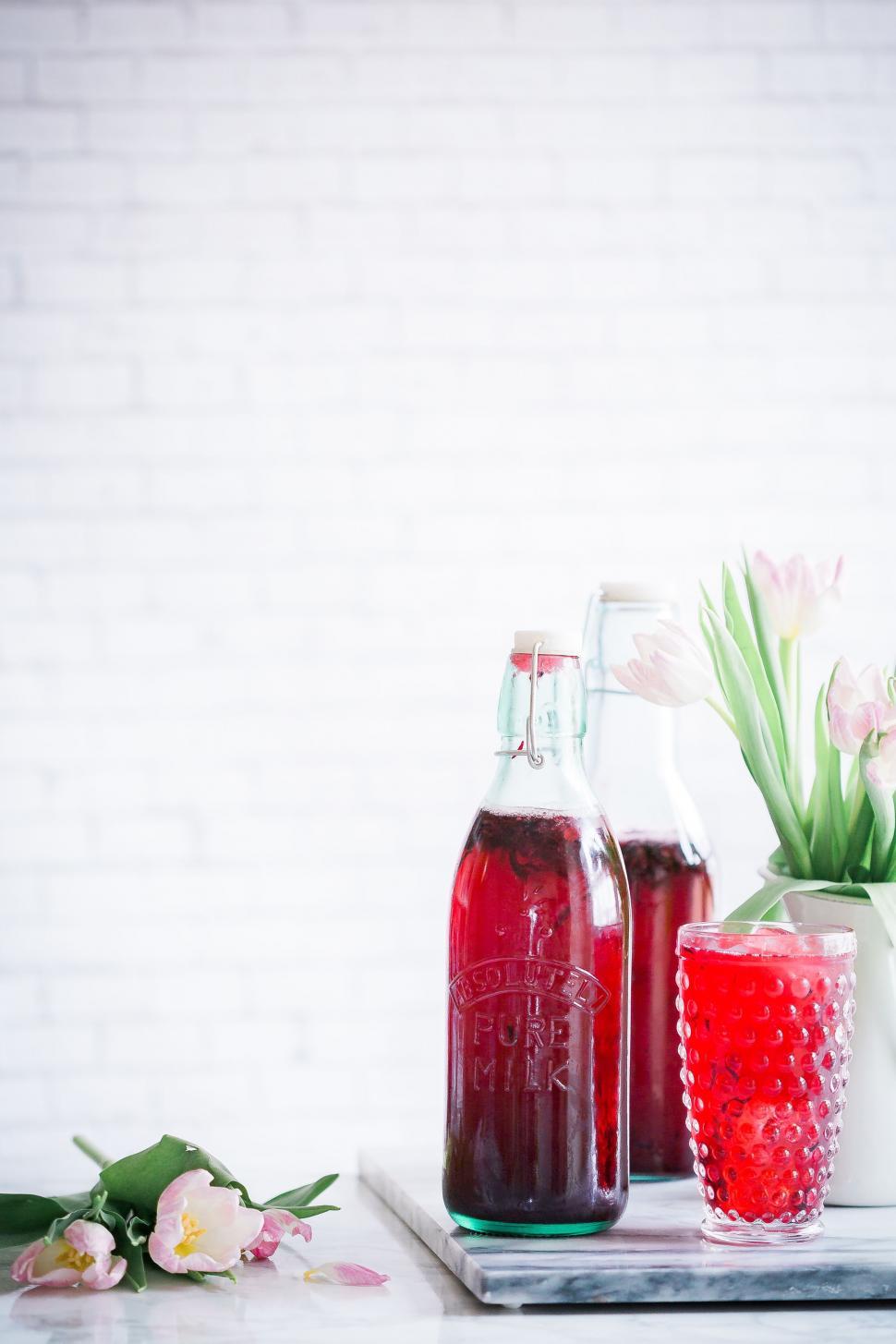 Free Image of Two Bottles of Liquid on a Table 