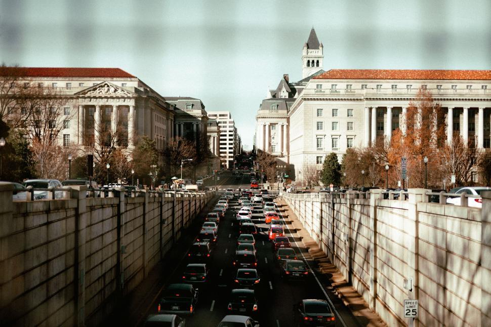 Free Image of Bustling City Street With Heavy Traffic and Tall Buildings 