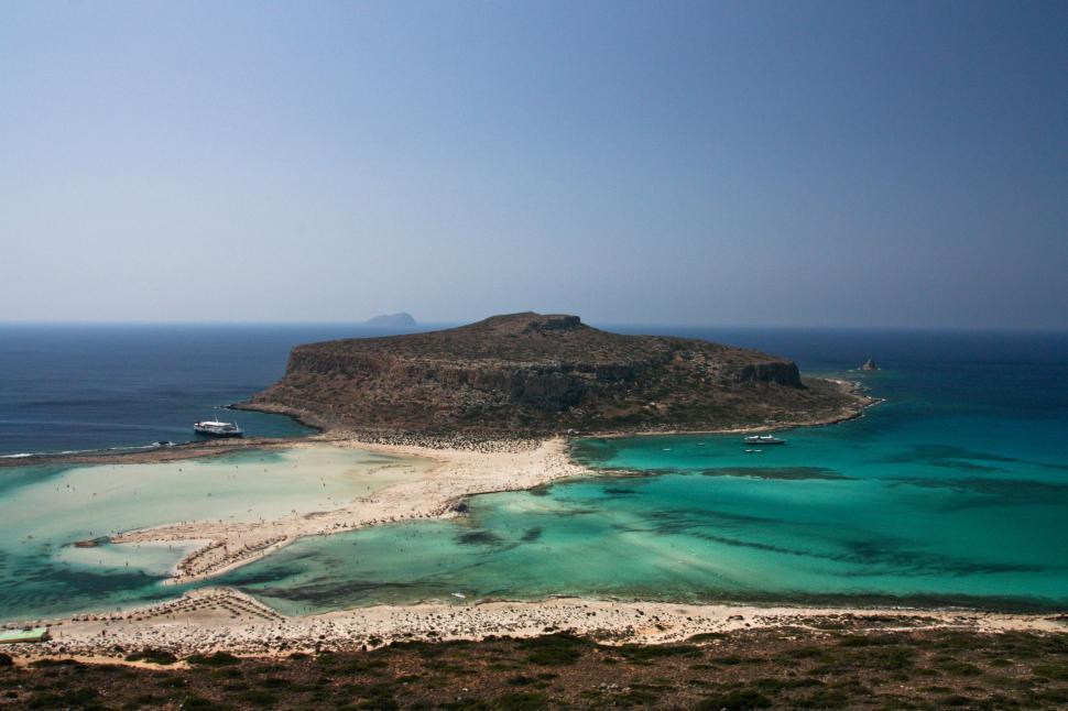 Free Image of Small Island Amidst Vast Ocean 