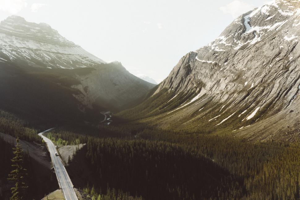 Free Image of Long Road Winding Through Mountain Range 