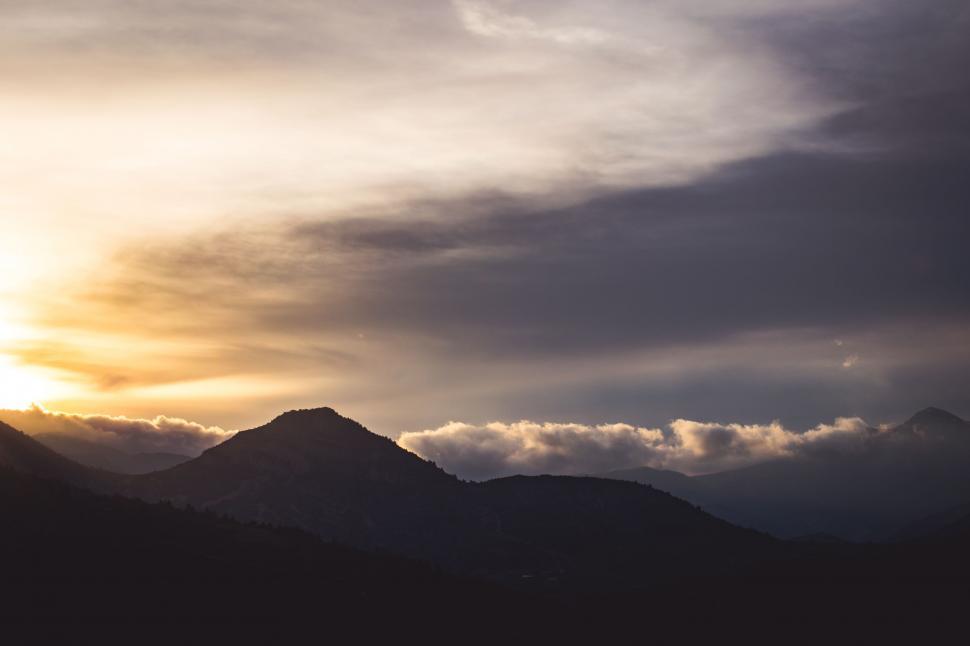 Free Image of Sun Setting Behind Mountain Range 