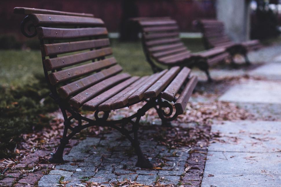 Free Image of Row of Wooden Benches on Sidewalk 