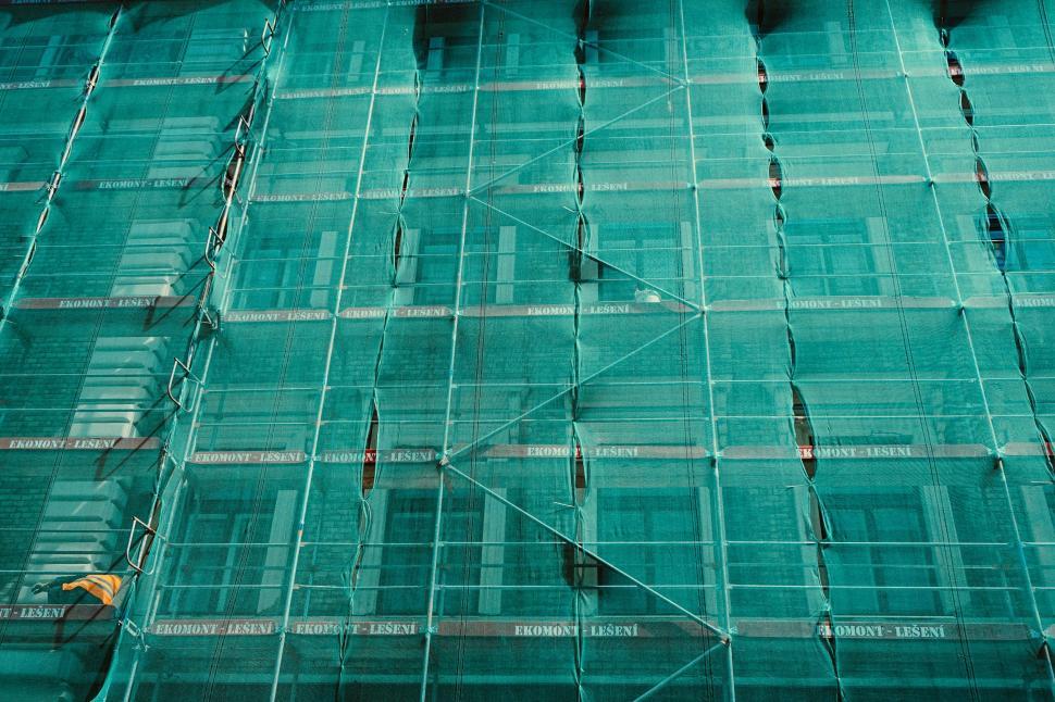 Free Image of Man Riding Skateboard on Scaffolding 