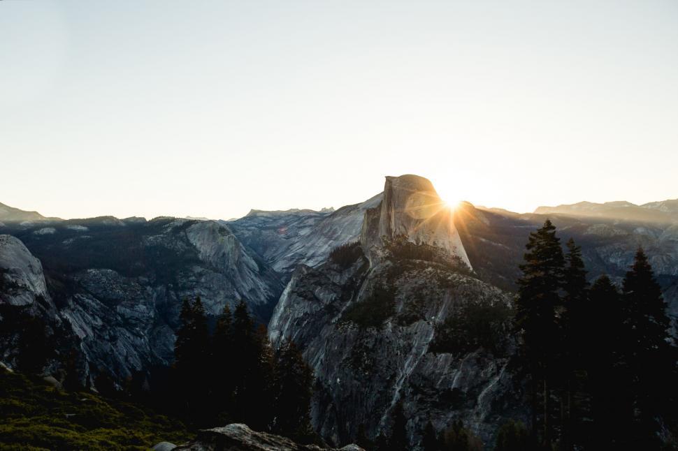 Free Image of Sun Shining on Mountain Peak 