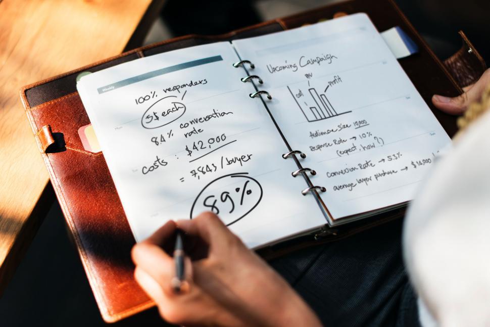 Free Image of Person Writing on a Notebook With a Pen 