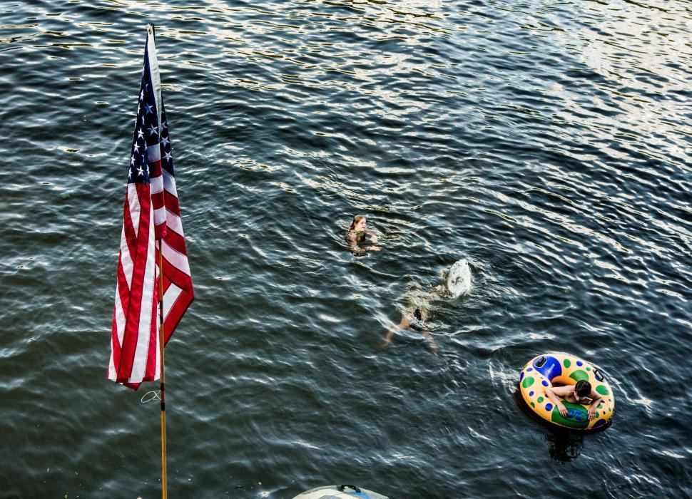 Free Image of Group of People Swimming in a Lake 