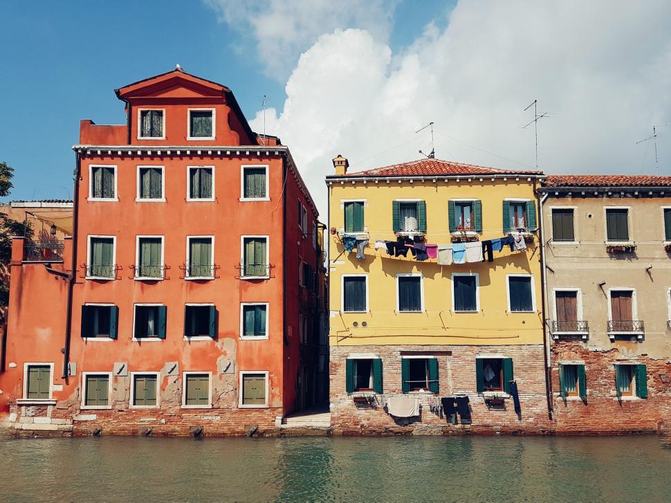 Free Image of Row of Buildings Alongside Waterfront 
