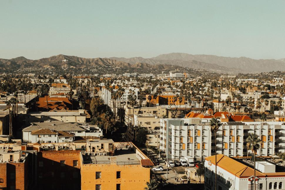 Free Image of Aerial View of City With Mountains in Background 