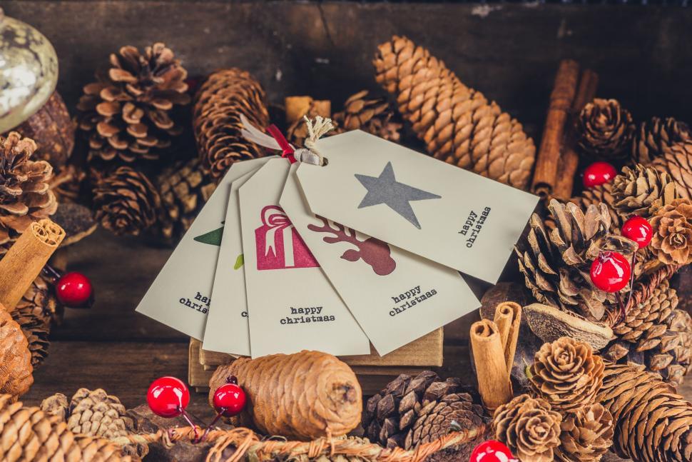 Free Image of Pile of Pine Cones With Tags 