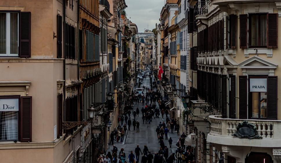 Free Image of Group of People Walking Down a City Street 
