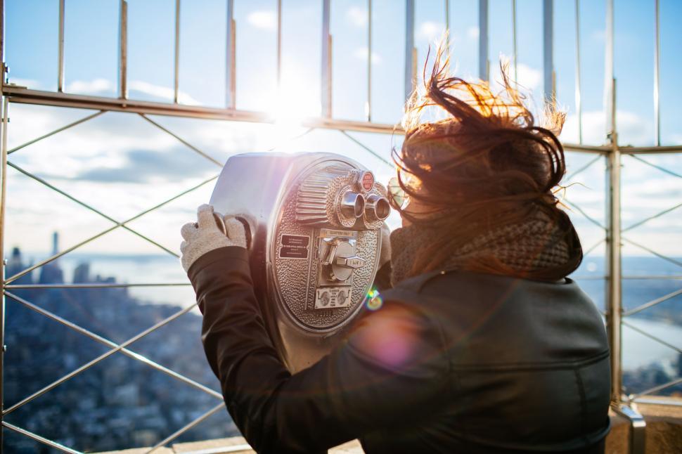 Free Image of Woman Looking Through Telescope at Sky 