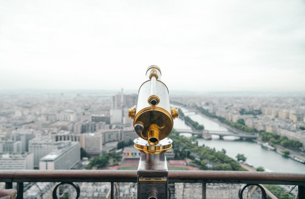 Free Image of Telescope Observing Cityscape From Building Rooftop 