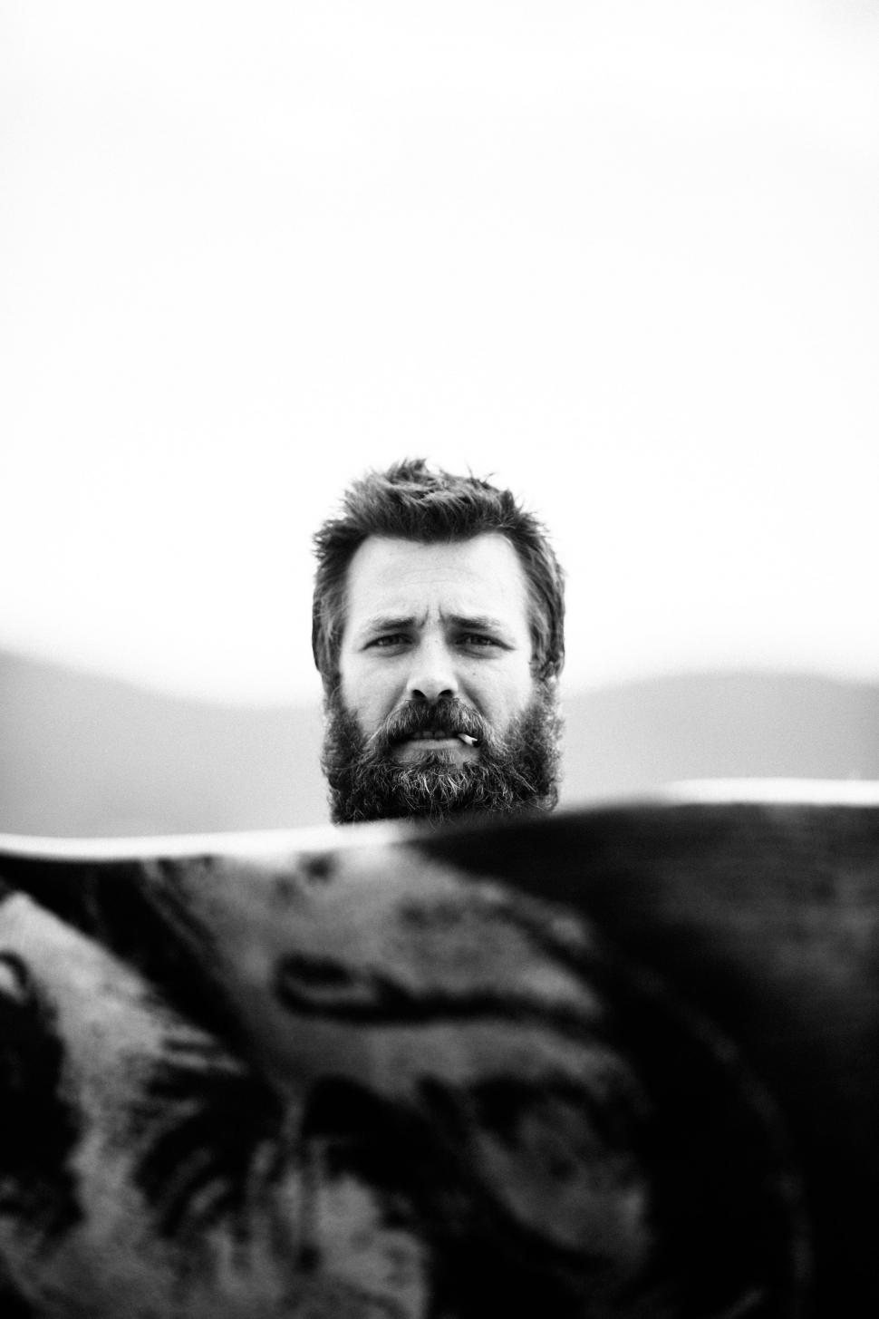 Free Image of Bearded Man Looking at Something 