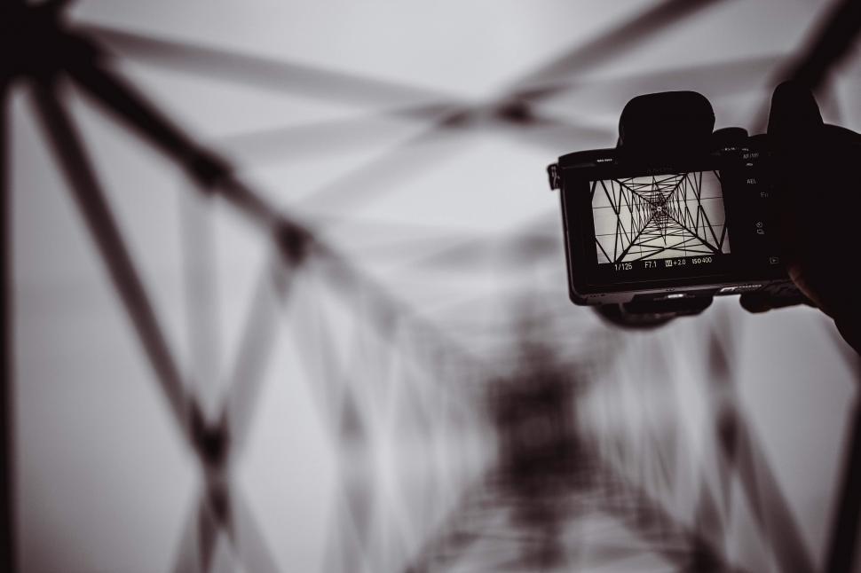 Free Image of Person Holding Camera in Black and White 