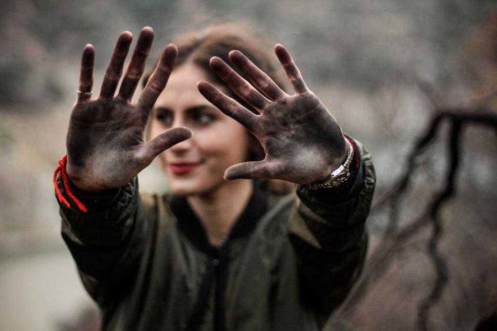 Free Image of Woman Raising Hands in the Air 