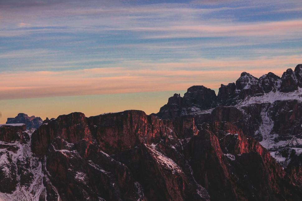 Free Image of Majestic Snow Covered Mountain Under a Clear Sky 