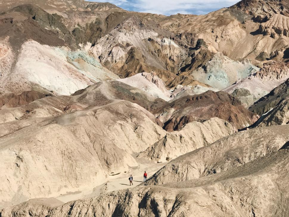 Free Image of Group of People Standing on Top of a Mountain 