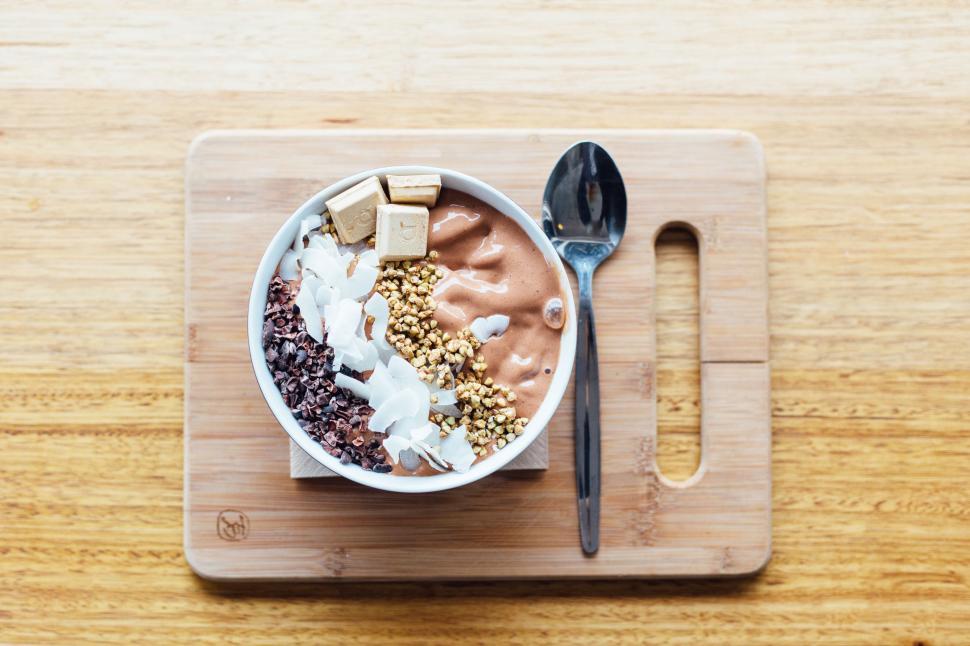 Free Image of Wooden Cutting Board With Bowl of Food 