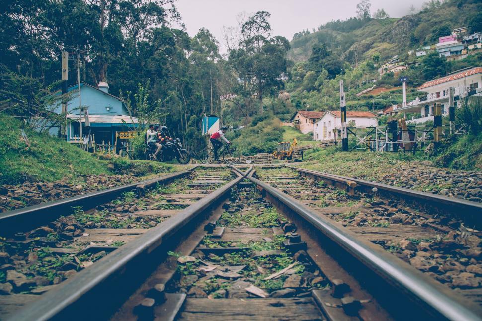 Free Image of Train Track With Houses in the Background 