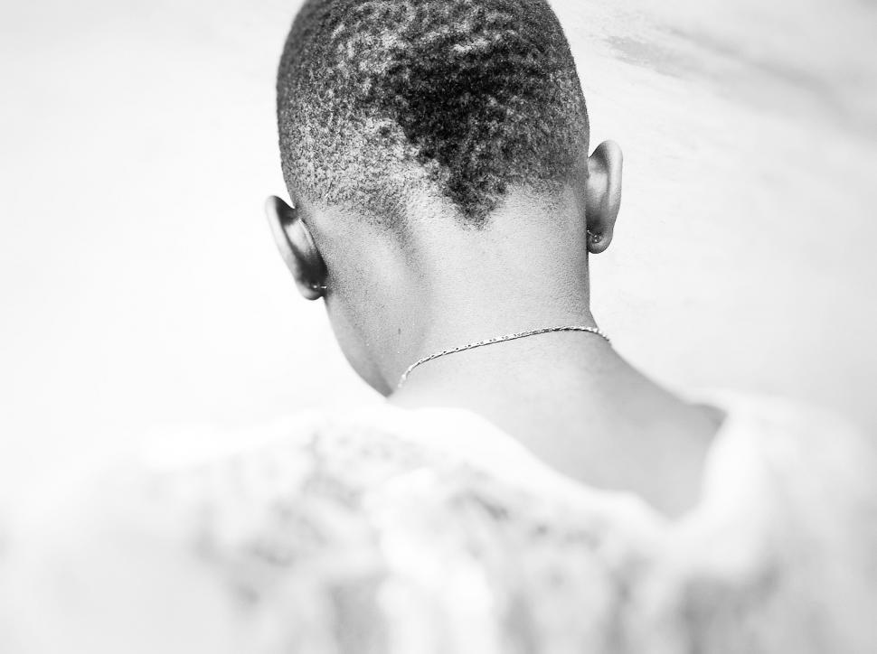 Free Image of Woman With Shaved Back and Necklace 